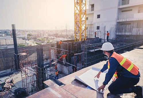 Construction worker overseeing work